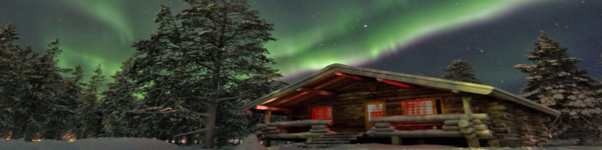 Northern lights over a cabin.