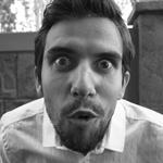 Close up of table with notebooks and a laptop